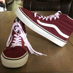 Maroon high top vans.